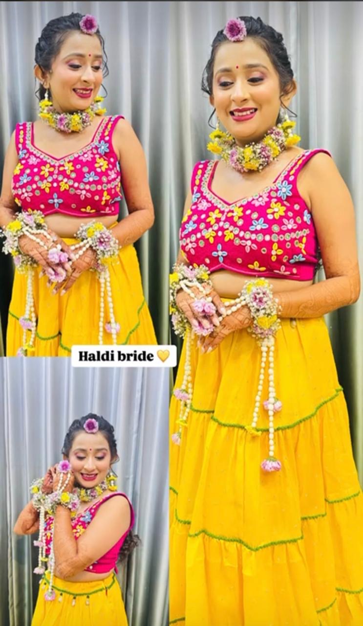     “Beautiful haldi bride wearing colorful floral jewelry set with yellow lehenga, pearl kaleeras, and fresh flower accessories for mehndi and haldi ceremony.”