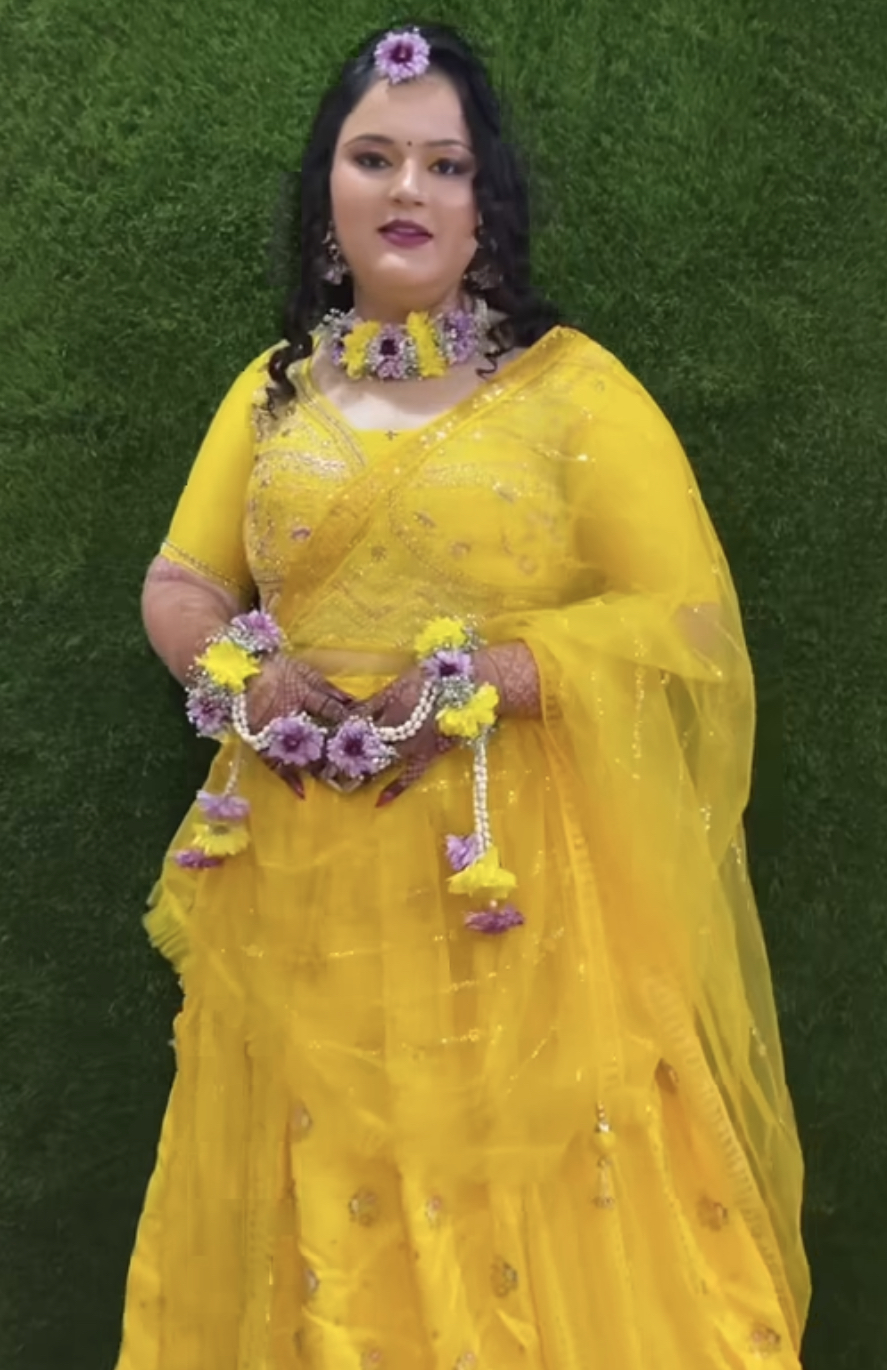     Elegant haldi ceremony look with yellow saree and handmade floral jewelry set including necklace, earrings, and floral bangles for bridal functions