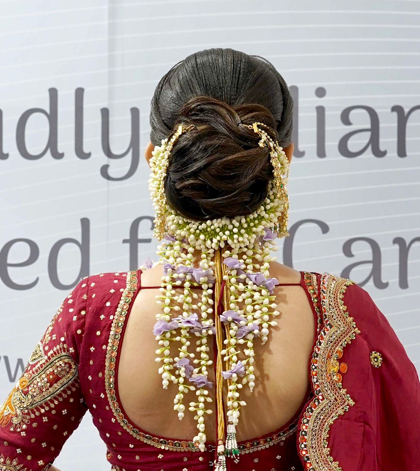     Traditional South Indian bridal hairstyle with fresh jasmine flower braid and elegant floral hair accessories for wedding and bridal makeup inspiration.
