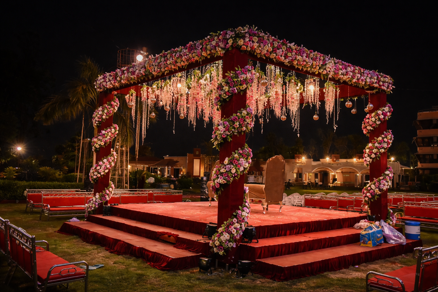 Luxury night wedding chori decoration with floral canopy, hanging flowers, crystal lights and elegant stage setup by Jatin Flower Mart
